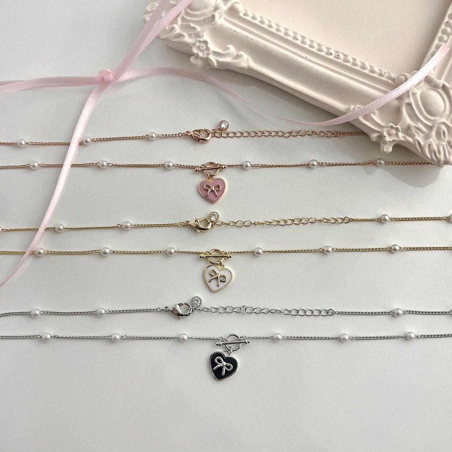 KOKOA Heart-Shaped Charm Necklace with Ribbon Decor and Pearl Beads – Elegant, Stylish, and Timeless