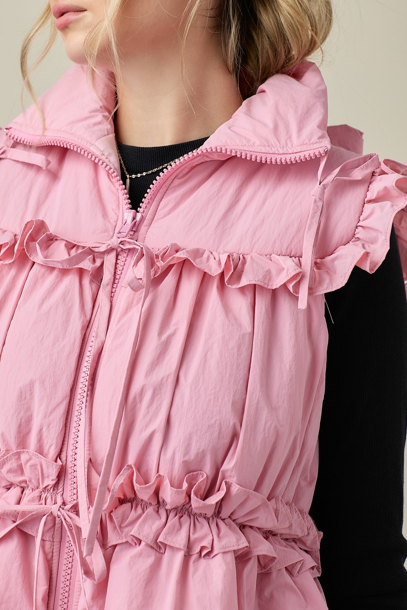 Pink Puffer Vest With Bow Detail