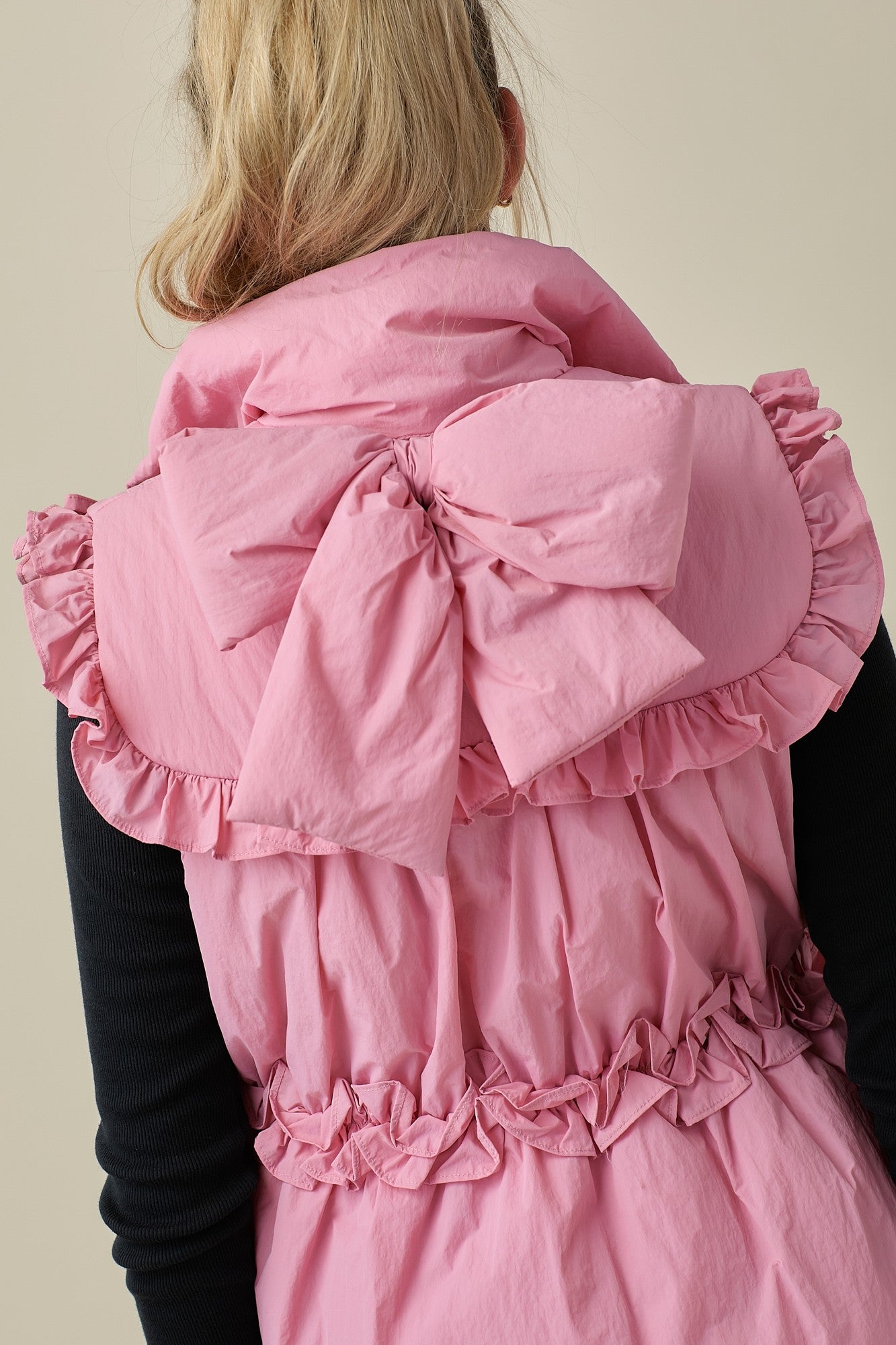 Pink Puffer Vest With Bow Detail