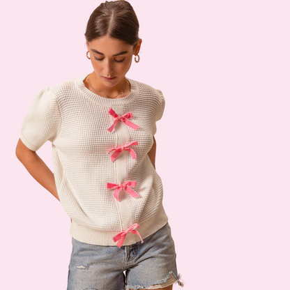 Textured sweater knit top with velvety ribbon trim on the front, offering a chic and sophisticated look with comfortable knit fabric, perfect for elegant and casual outfits.