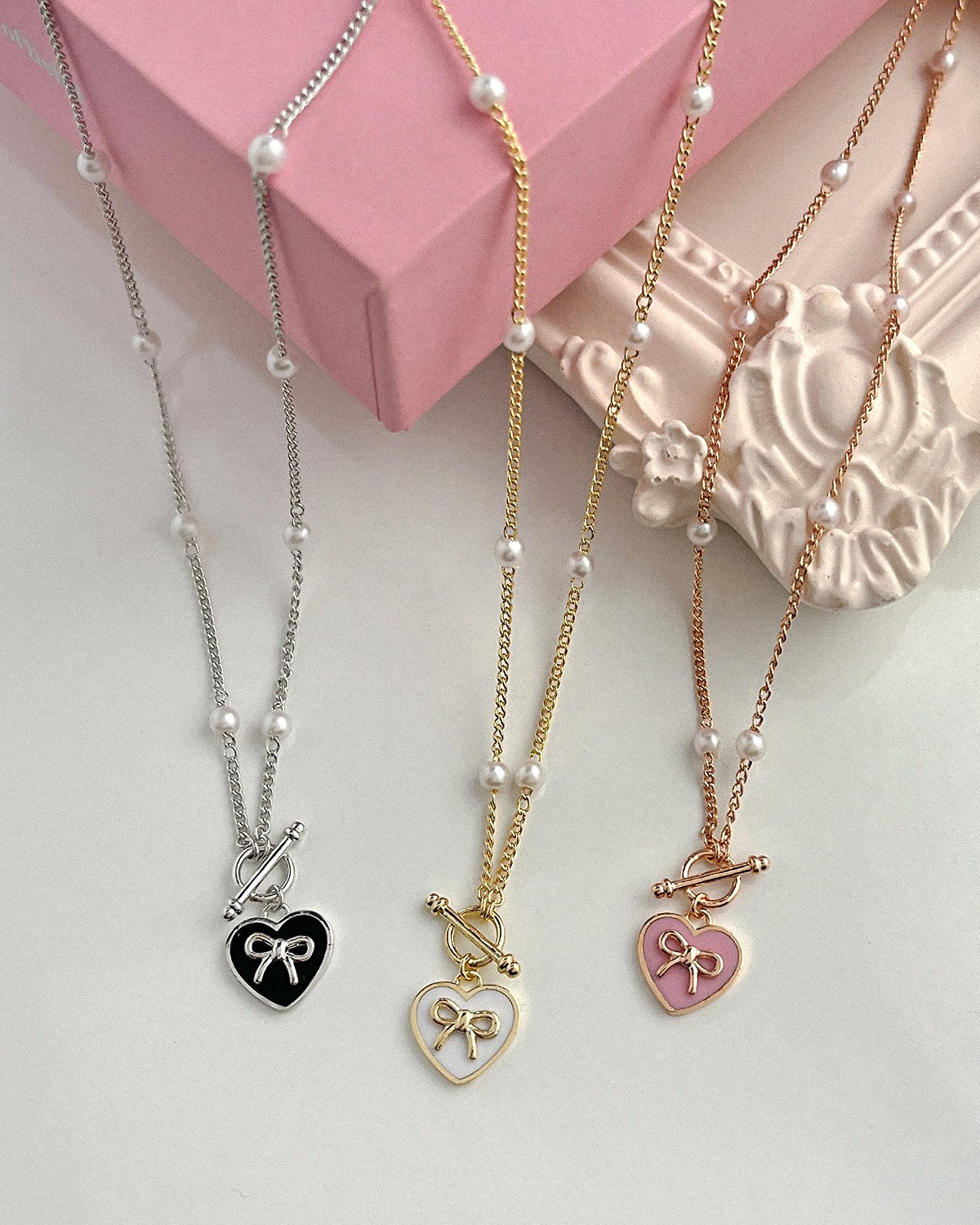 KOKOA Heart-Shaped Charm Necklace with Ribbon Decor and Pearl Beads – Elegant, Stylish, and Timeless